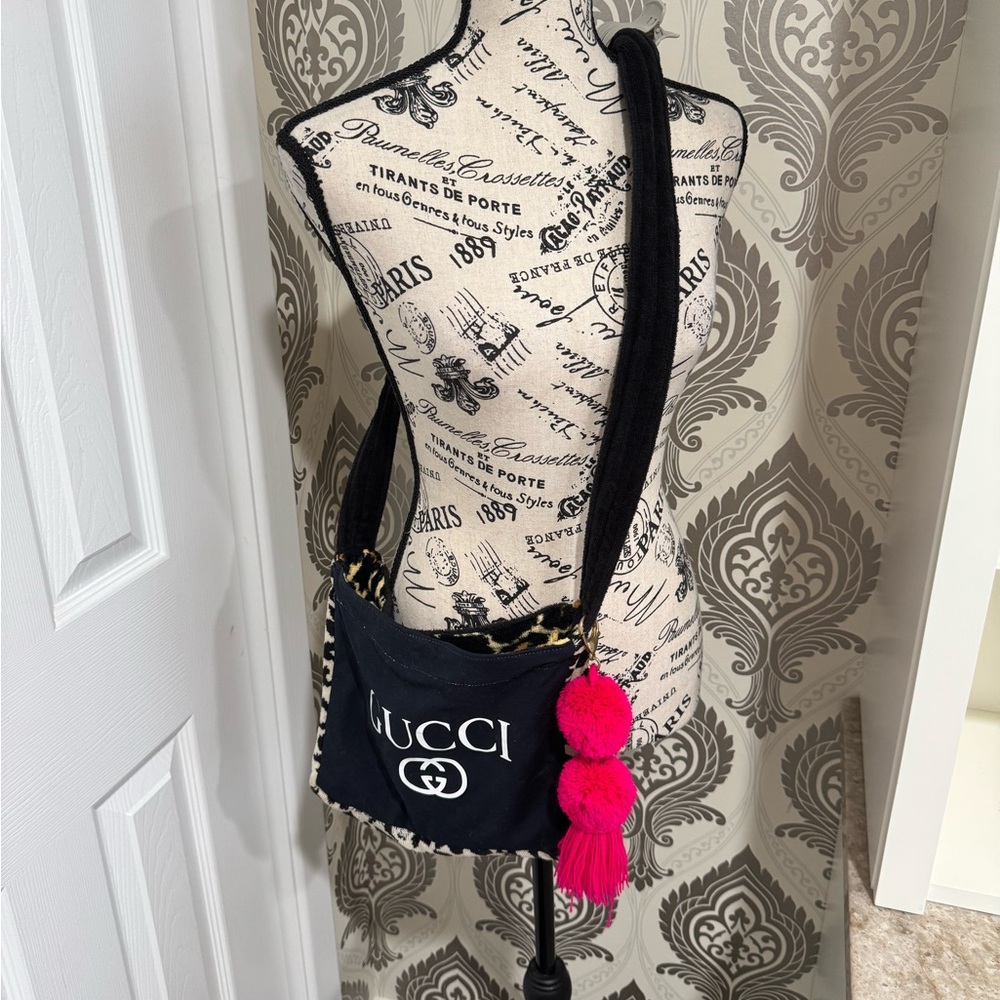 Black and Pink Crossbody Bag with Iconic Design